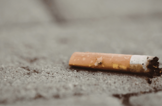 A cigarette butt on the ground